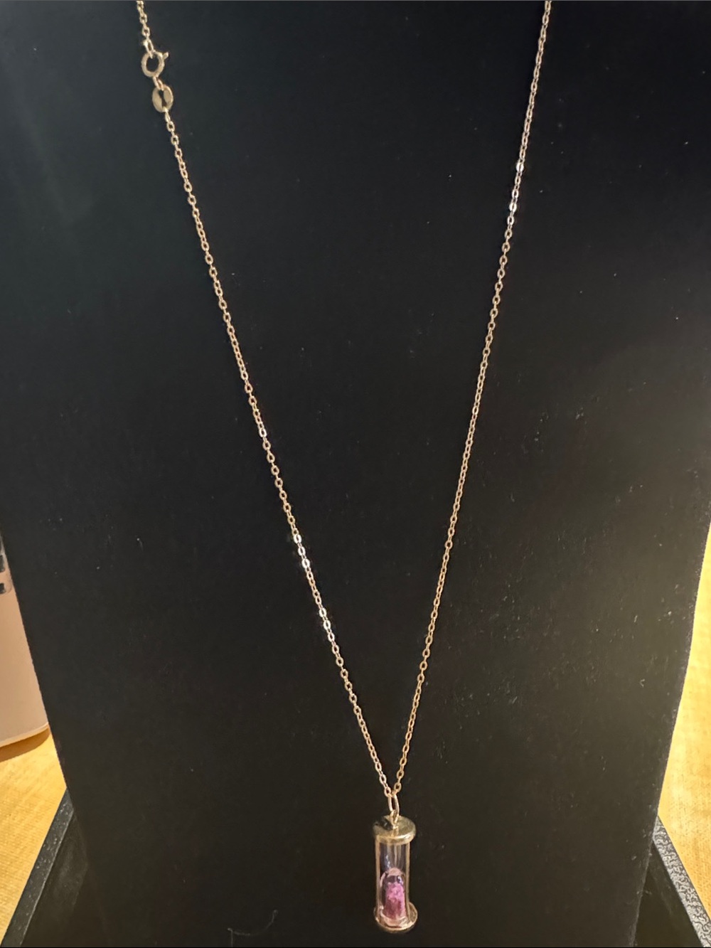 Elegant Gold-Tone Hourglass Pendant Necklace with Pink Detail